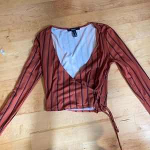 Long sleeve orange and black wrap shirt size small